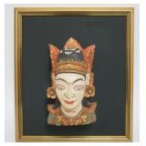 1066	HAND CARVED WOOD INDONESIAN HEAD FRAME, APPROXIMATELY 16 IN X 18 IN, OVERALL