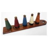 1087	PRIMITIVE HANGING WOOD YARN HOLDER, APPROXIMATELY 2 1/2 IN  X 14 IN 