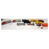 1100	GROUP OF ASSORTED LIONEL O GUAGE TRAIN CARS AND SANTA FE ENGINE