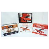 1102	4 DIE CAST AIRPLANE COIN BANKS IN ORGINAL BOXES