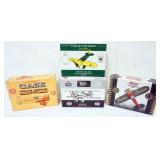 1103	4 DIE CAST AIRPLANE COIN BANKS IN ORGINAL BOXES