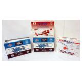 1105	4 DIE CAST AIRPLANE COIN BANKS IN ORGINAL BOXES