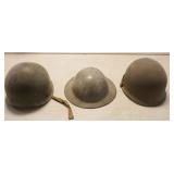 1124	GROUP OF 3 METAL MILITARY HELMETS