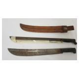 1125	2 MACHETES, EACH APPROXIMATELY 23 IN