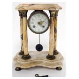 1134	FRENCH MARBLE CLOCK WITH 4 COLUMNS AND PORCELAIN DIAL, BRONZE FERUIS, APPROXIMATELY 10 IN X 5 I