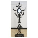 1252	ANTIQUE CAST IRON HALL RACK WITH MIRRORED CENTER AND EMBOSSED FLORAL DESIGN, APPROXIMATELY 27 I