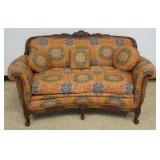 1268	WALNUT CARVED UPHOLSTERED LOVE SEAT, APPROXIMATELY 60 IN X 32 IN X 37 IN H