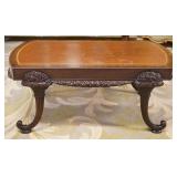 1271	UNUSUAL LEATHER TOP MAHOGANY COFFEE TABLE WITH CARVED CORNUCOPIA LEGS, APPROXIMATELY 42 IN X 23