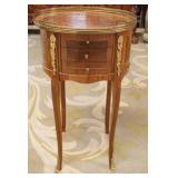 1276	SMALL OVAL 3 DRAWER STAND WITH BRONZE GALLERY TOP AND APPLIED MOUNTS, APPROXIMATELY 16 IN X 13 