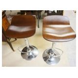 1301A	PAIR OF MODERN STYLE STOOLS ON CHROME BASES, EACH APPROXIMATELY 15 IN X 17 IN X 30 IN HIGH