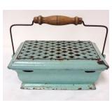 1057	CAST IRON GREEN ENAMELED FOOTWARMER, APPROXIMATELY 10 IN X 7 IN X 4 IN
