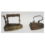 1084	2 ANTIQUE COAL FLAT IRONS, ONE BRASS, LARGEST APPROXIMATELY 8 IN X 4 IN X 7 IN HIGH