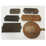 1111	ASSORTED ANTIQUE CAST IRON CORN BREAD MOLDS, 1 WITH CACTUS AND CAST IRON GRIDDLE, LARGEST APPRO