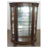 1165	OAK BOW FRONT, CURVED GLASS CRYSTAL CABINET WITH CORINTHIAN COLUMNS AND CARVED PAW FEET, APPROX