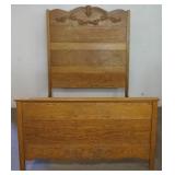 1170	OAK BED WITH APPLIED CARVING, APPROXIMATELY 59 IN W X 78 IN X 75 IN H