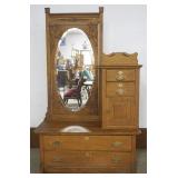 1191	OAK BONNET CHEST WITH LARGE OVAL MIRROR WITH CARVED EDGES, 4 DRAWER, 1 DOOR AND PANELED SIDES, 