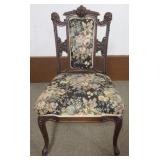 1197	VICTORIAN WALNUT UPHOLSTERED PARLOR CHAIR WITH CARVED HEADS AND NORTH WIND FACE AT SIDES AND CE