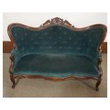 1201	WALNUT VICTORIAN UPHOLSTERED LOVE SEAT WITH CARVED CREST AND BUTTON BACK, APPROXIMATELY 36 IN X