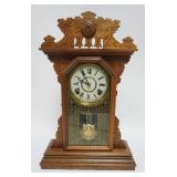 1002	EN WELCH WALNUT CASED GINGERBREAD SHELF CLOCK, APPROXIMATELY 15 IN X 5 IN X 22 IN HIGH