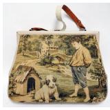 1126	BOBBIE JEROME TAPESTRY PURSE W/IMAGE OF BOY & HIS DOG, SIDE & STRAP WORN, PURSE APPROXIMATELY 1