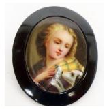1132	PAINTED CENTER PORCELAIN BROACH, IMAGE OF WOMAN & HER DOG, APPROXIMATELY 1 3/4 IN X 2 IN