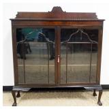 1246	MAHOGANY DOUBLE DOOR BOOKCASE ON BALL AND CLAW FEET AND 2 ADJUSTABLE SHELVES, APPROXIMATELY 50 