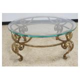 1236	ROUND GLASS TOP COCKTAIL TABLE ON FANCY WROUGHT IRON BASE, APPROXIMATELY 42 IN ROUND X 19 IN H