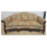 1255	FLORAL UPHOLSTERED TUFTED BACK SOFA WITH HEAVILY CARVED FRAME, APPROXIMATELY 78 IN X 39 IN X 38