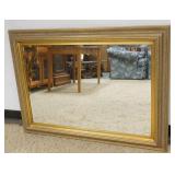 1219	BEVELED EDGE MIRROR IN GILT FINISH FRAME, APPROXIMATELY 44 IN X 32 IN