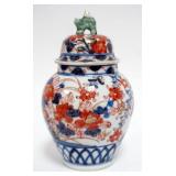 1040	ASIAN COVERED JAR W/FOO DOG FINIAL TOP, LOSS TO TOP, APPROXIMATELY 7 IN HIGH