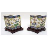1075	PAIR OF ASIAN PORCELAIN PLANTERS ON WOOD STANDS, EACH APPROXIMATELY 10 IN X 5 IN X 8 IN OVERALL