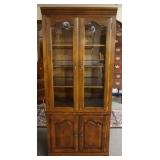 1211	ETHAN ALLEN 2 PART CURIO CABINET W/3 SHELVES, 2 ADJUSTALBE W/INTERIOR LIGHTS, APPROXIMATELY 34 