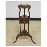 1215	BAKER MAHOGANY WIG STAND W/BRASS LINER & ONE DRAWER, APPROXIMATELY 21 IN X 18 IN X 33 IN HIGH