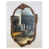 1084	HANGING MIRROR IN ORNATE WALNUT FRAME, APPROXIMATELY 43 IN X 30 IN