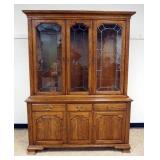 1200	ETHAN ALLEN OAK BREAKFRONT WITH LEADED GLASS DOORS AND INTERIOR LIGHTS, APPROXIMATELY 62 IN X 2