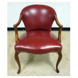 1205	RED LEATHER ARM CHAIR WITH BRASS TACK ACCENTS, APPROXIMATELY 25 IN X 22 IN X 35 IN H