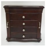 1100	MAHOGANY FINISHED WOOD JEWELRY CHEST HAVING A LIFT TOP, 2 DOORS AND 4 CENTER DRAWERS, APPROXIMA