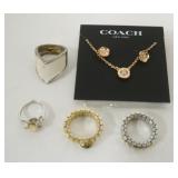 1133	COACH EARRING AND NECKLACE SET NEW AND MISC RINGS INCLUDING NOMINATION AND PAULINE RADER