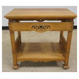 1231	ARTS AND CRAFTS STYLE OAK TABLE WITH TURNED COLUMN SIDES AND SCROLLED SNAKE LIKE CARVED CUT OUT