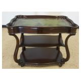 1241	MAHOGANY ROLLING SERVING CART WITH SCROLLED LEG SIDES AND TOOLED LEATHER TOP, APPROXIMATELY 36 