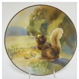1057	HAND PAINTED NIPPON PLATE W/RELIEF IMAGE OF SQUIRREL EATING PEANUTS, APPROXIMATELY 10 3/4 IN
