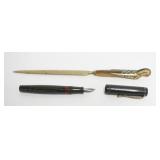 1132	BRASS AND CARVED HORN LETTER OPENER AND FOUNTAIN PEN