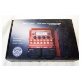 1165	ZOOM BIX FOUR BASS MULTI EFFECTS PROCESSOR, APPROXIMATELY 10 IN X 7 IN X 1 IN