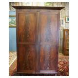 1202	ANTIQUE MAHOGANY 2 DOOR WARDROBE ON BUN FEET WINTERIOR DRAWRS & FLAMED MAHOGANY PANELED DOORS D