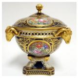 1001	DERBY PORCELAIN BOLTED COVERED URN WITH GILT ACCENTS AND RAMS HEADS, APPROXIMATELY 11 1/2 IN H