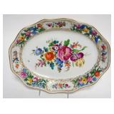 1009	HAND PAINTED OVAL PORCELAIN BREAD PLATE WITH FLOWERS AND PIERCED EDGE, APPROXIMATELY 11 IN X 9 