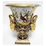 1029	LARGE ANTIQUE HAND PAINTED PORCELAIN DOUBLE HANDLE URN WITH GROTESQUE FACE HANDLES AND IMAGES O