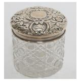 1055	STERLING SILVER AND CUT GLASS VANITY JAR, APPROXIMATELY 2 1/2 IN X 2 1/2 IN