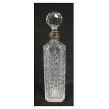 1119	CUT CRYSTAL DECANTOR W/SILVERPLATE COLAR MADE IN PORTUGAL, APPROXIMATELY 13 IN HIGH