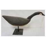 1050	HAND CARVED WOOD GOOSE ON METAL STAND, APPROXIMATELY 30 IN X 9 IN X 18 IN OVERALL